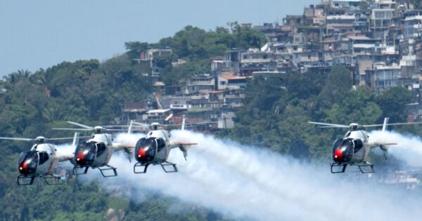 Spanish Air Force helicopter show amazes Rio beachgoers