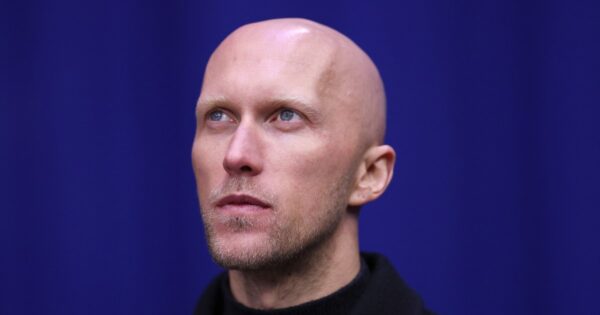 He coaches 16 skaters from 13 countries at the Winter Olympics — with the jackets to prove it