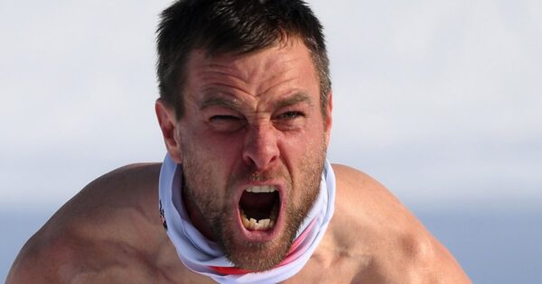Austria’s Karl celebrates split-second win bare-chested