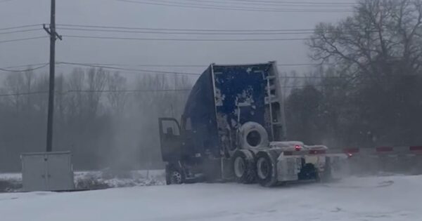 Train slams into semitruck during snowstorm