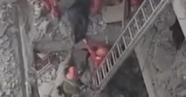 Rescue workers search rubble after airstrike in Tehran