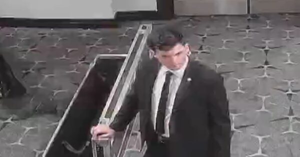 Video shows shooting suspect running through security