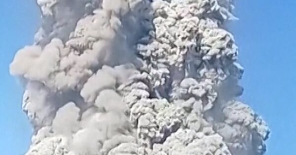 Hikers descend Mount Dukono after volcano erupts